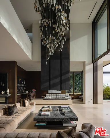 a view of kitchen with kitchen island granite countertop living room