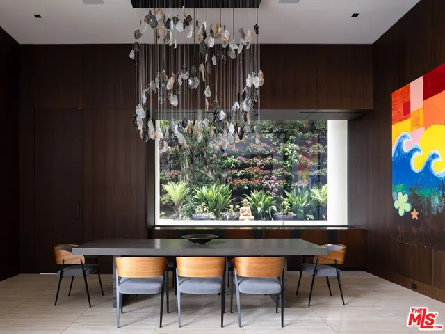 a view of a chairs and table in a room