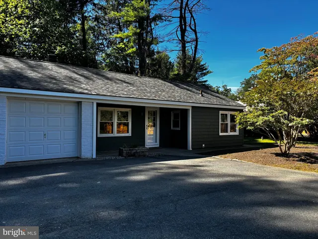 a front view of a house with yard