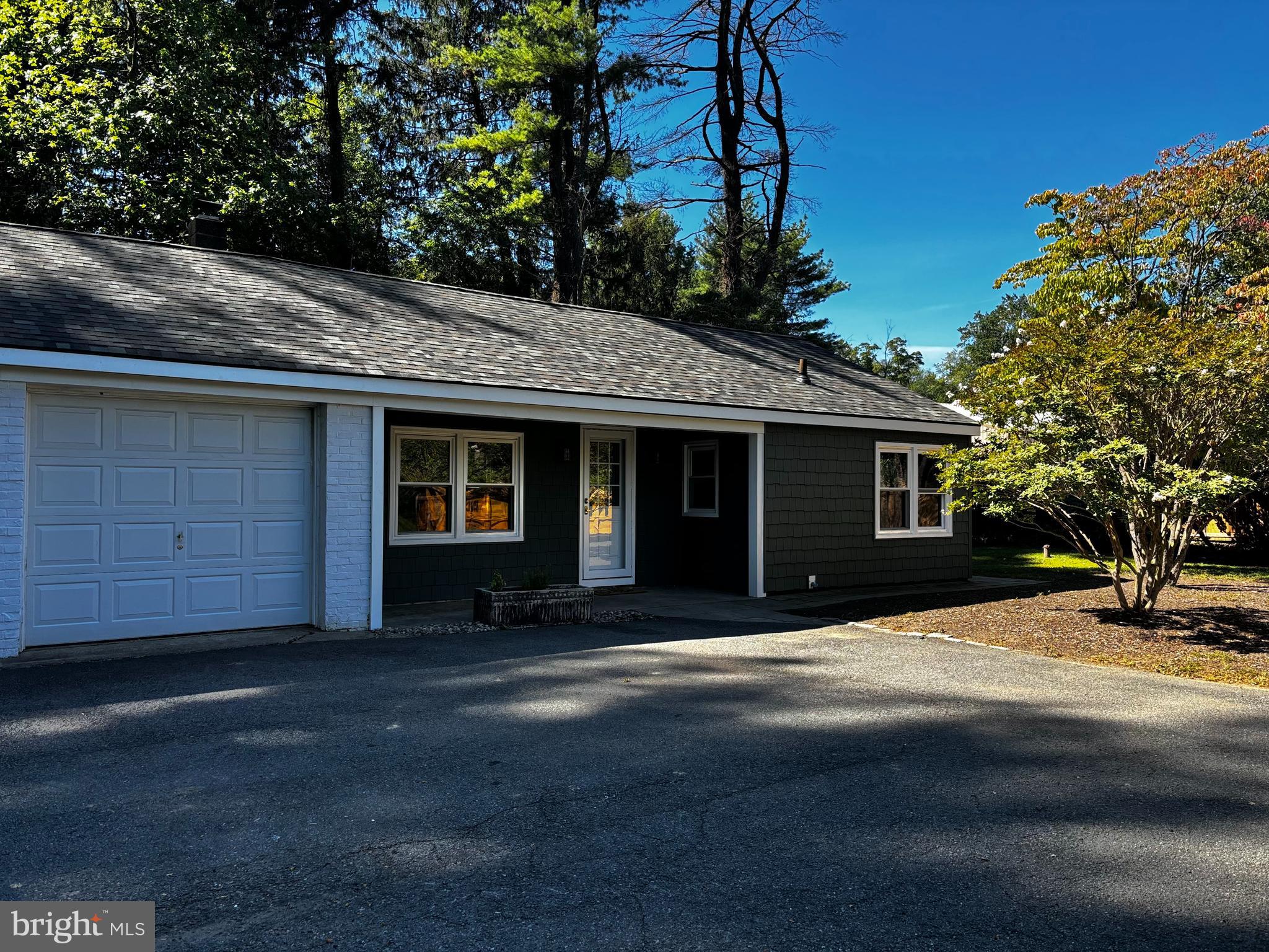 a front view of a house with yard