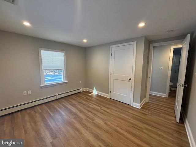 137 Carter Road Princeton, NJ 08540 - Photo 13 of 19 a view of an empty room with wooden floor and a window