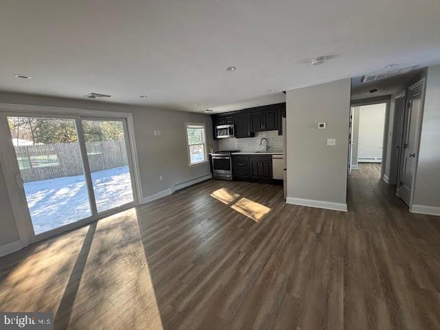 137 Carter Road Princeton, NJ 08540 - Photo 5 of 19 a view of empty room with wooden floor and fireplace