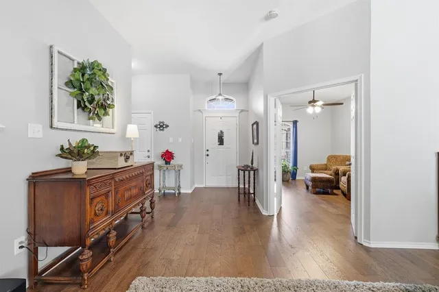 a hallway with view of living room