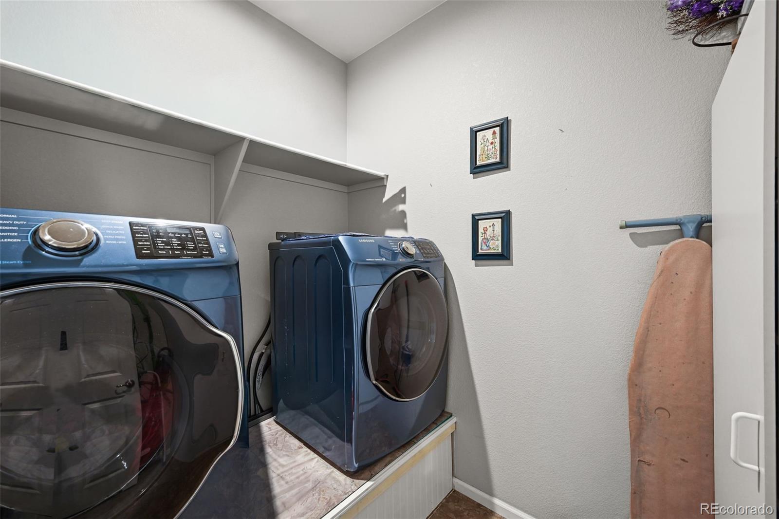 5230 Periwinkle Way Brighton, CO 80640 - Photo 14 of 44 a utility room with dryer and washer