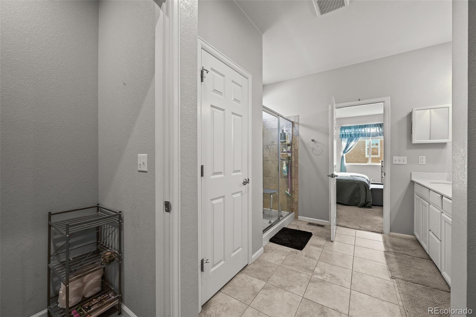 5230 Periwinkle Way Brighton, CO 80640 - Photo 21 of 44 a bathroom with a toilet and a shower