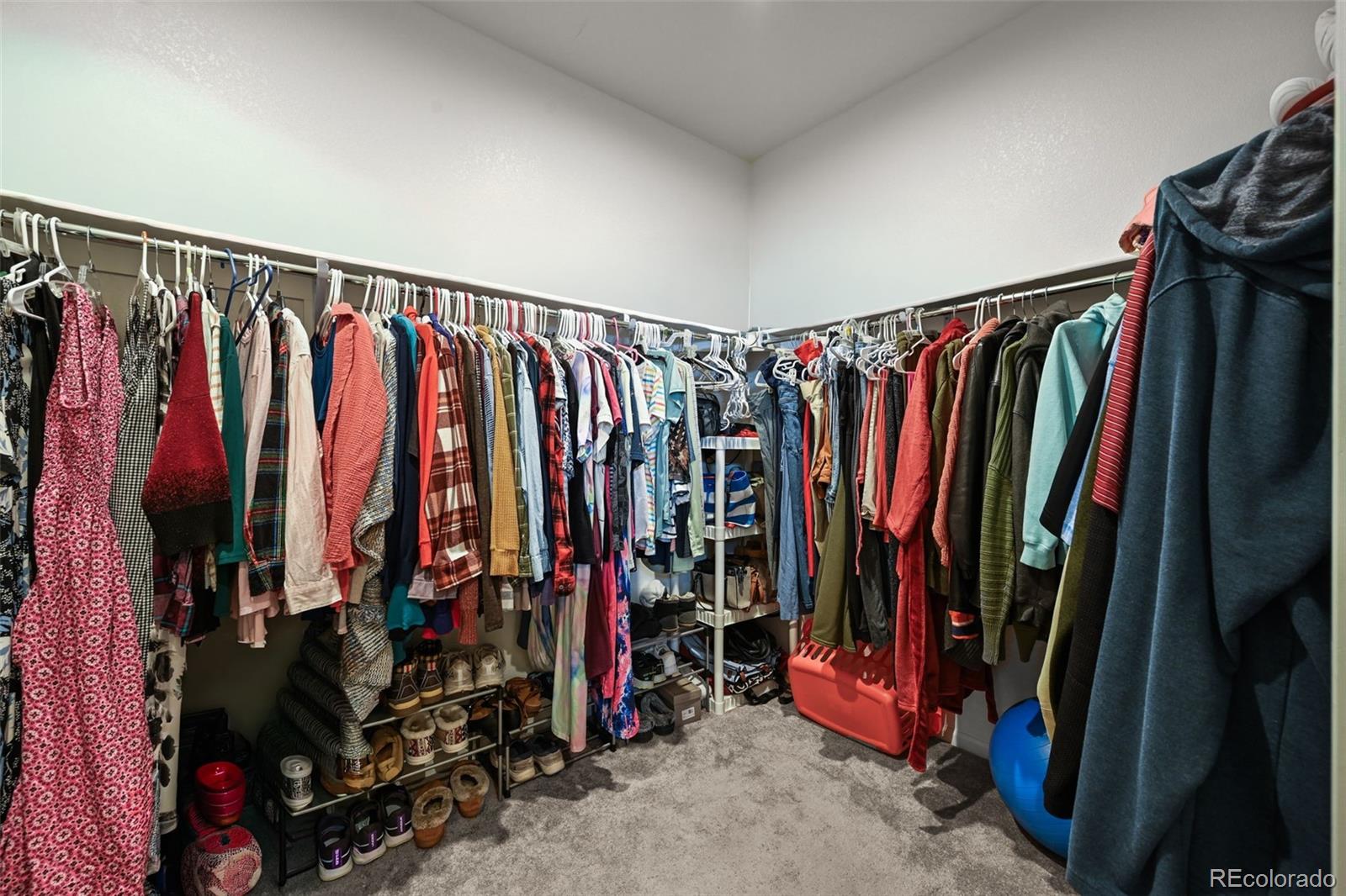 5230 Periwinkle Way Brighton, CO 80640 - Photo 22 of 44 a view of walk in closet with clothes