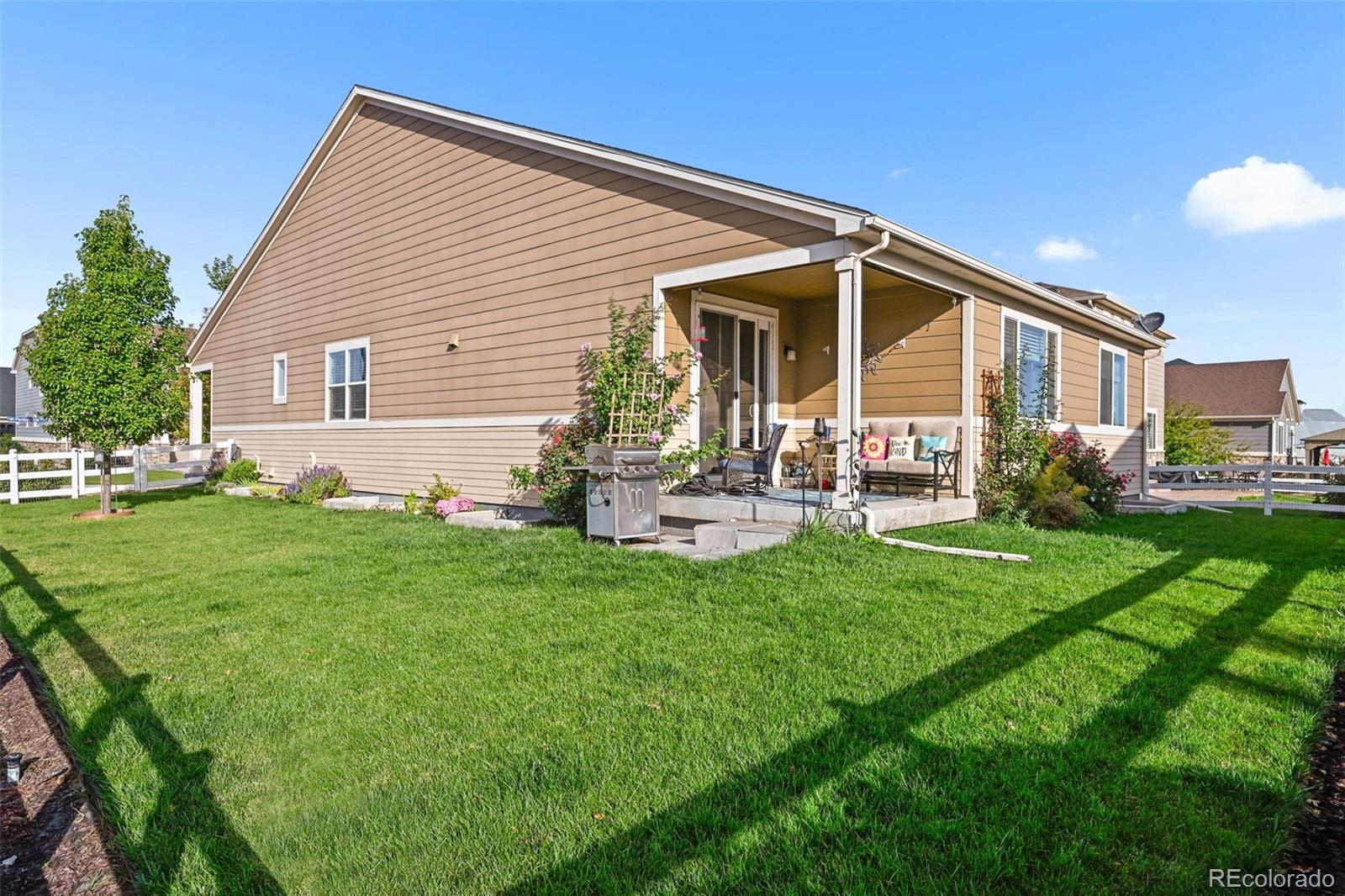 5230 Periwinkle Way Brighton, CO 80640 - Photo 31 of 44 a view of a house with backyard