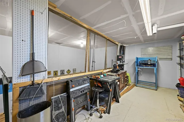 a kitchen with stainless steel appliances granite countertop a stove and a refrigerator