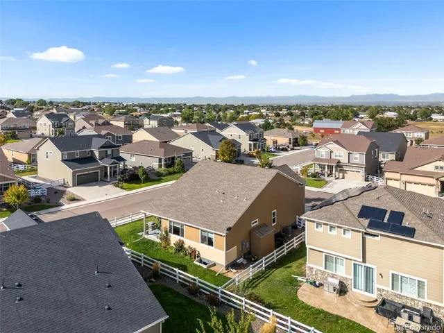 an aerial view of a house with a garden