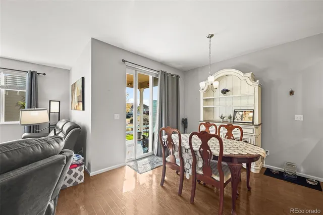 a view of a livingroom with furniture window and wooden floor