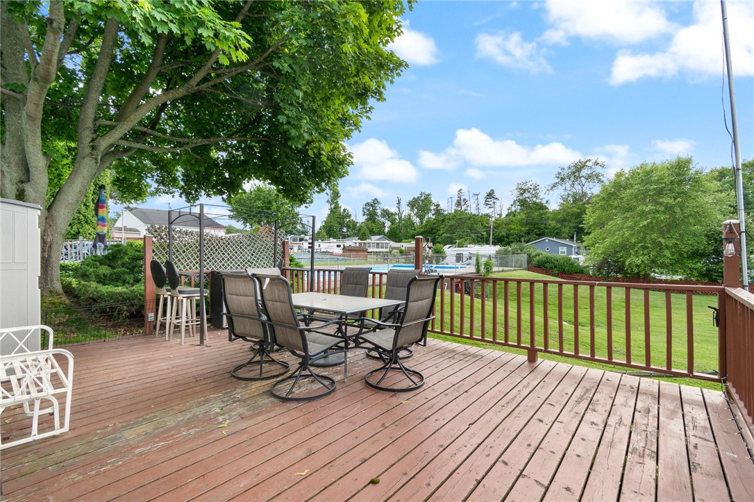 7945 Lake Road, Unit 44 AND 45 Sodus Point, NY 14555 - Photo 5 of 18 SPACIOUS DECK OVERLOOKING THE POOL- THERES ALSO A PLAYGROUND AND A CLUBHOUSE!
