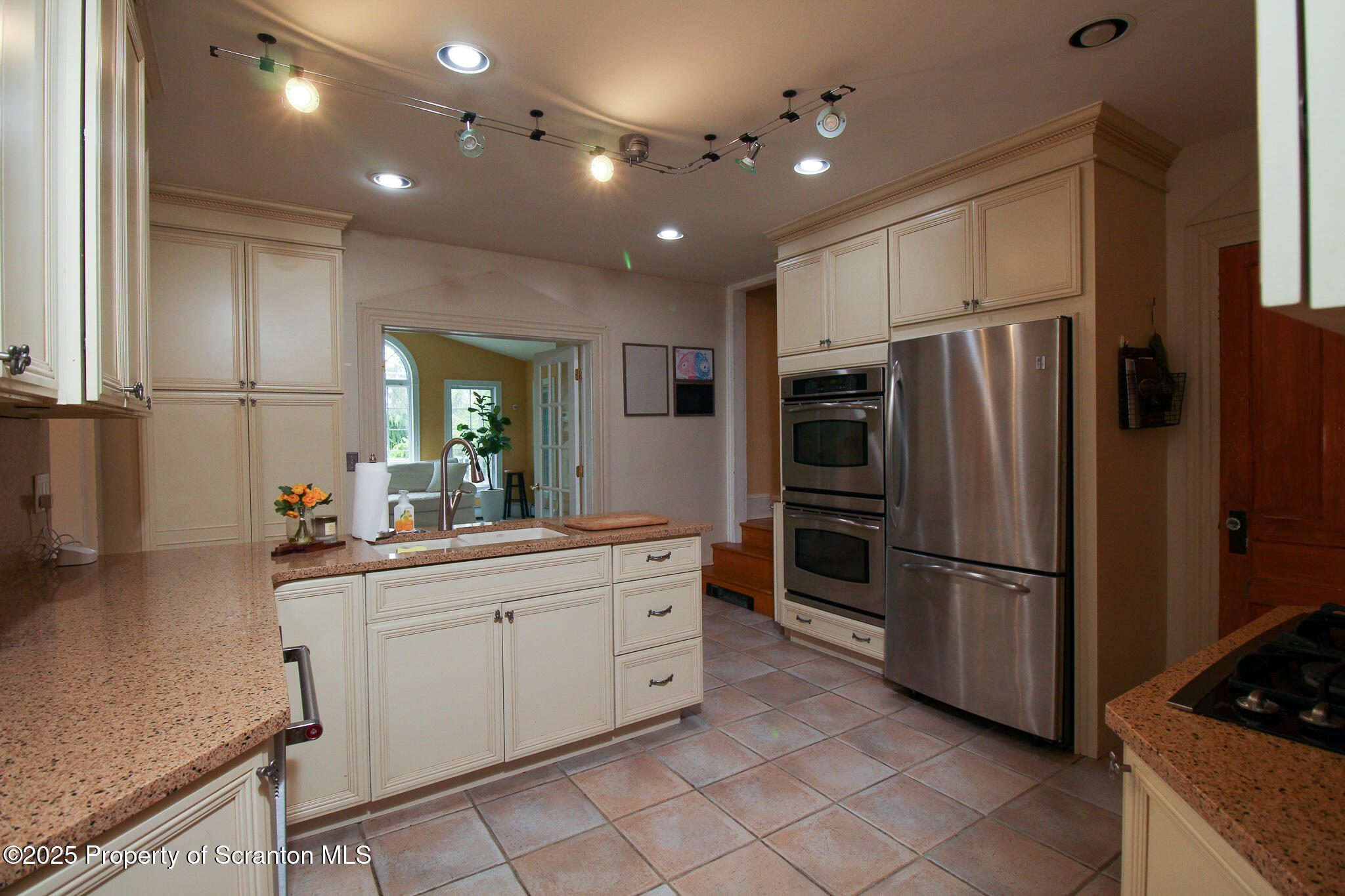 525 North Abington Road Clarks Summit, PA 18411 - Photo 11 of 61 a kitchen with white cabinets and stainless steel appliances