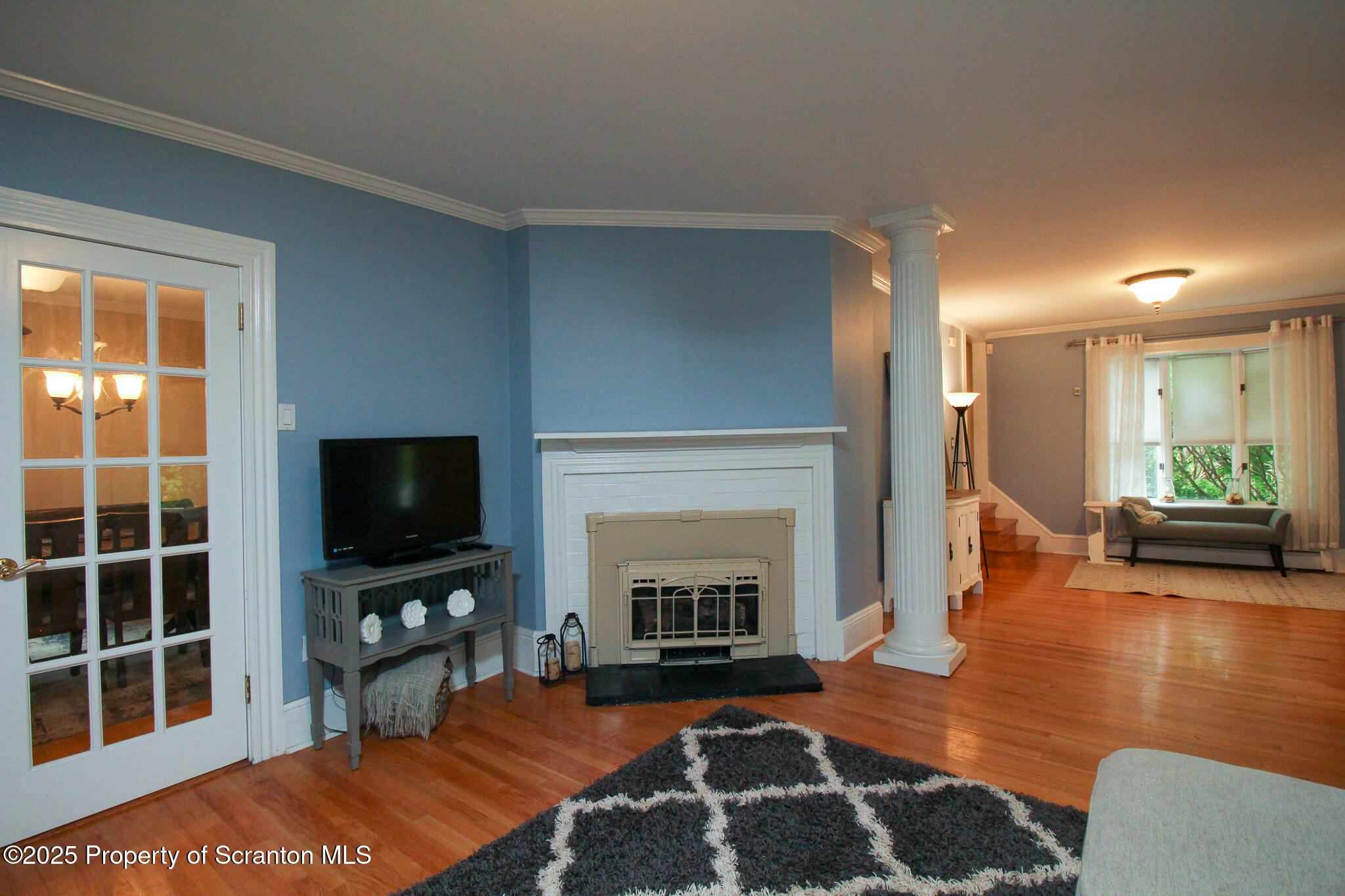 525 North Abington Road Clarks Summit, PA 18411 - Photo 14 of 61 a living room with furniture a fireplace and a flat screen tv