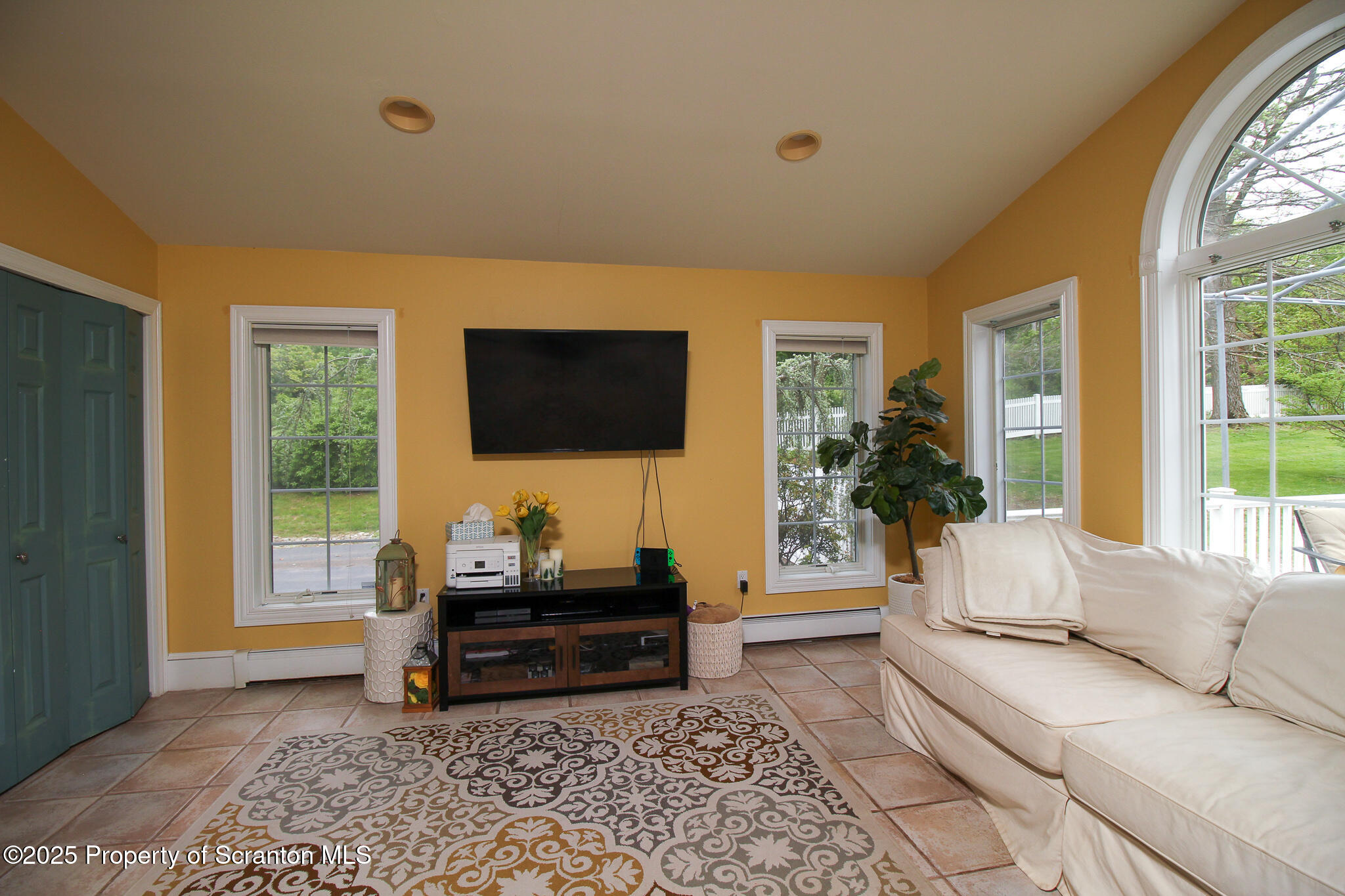 525 North Abington Road Clarks Summit, PA 18411 - Photo 21 of 61 a living room with furniture and a flat screen tv
