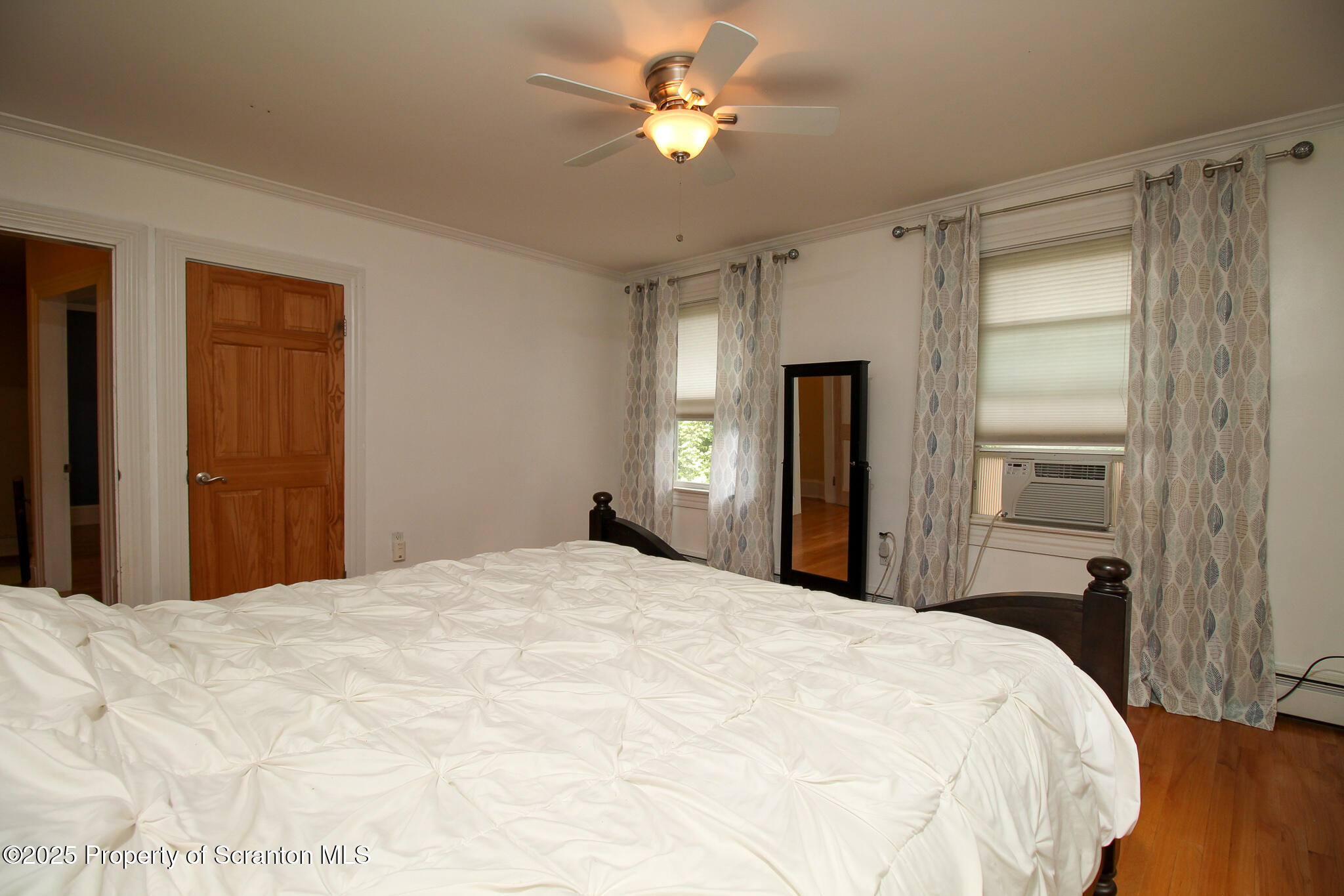 525 North Abington Road Clarks Summit, PA 18411 - Photo 28 of 61 a bedroom with a bed and a chandelier