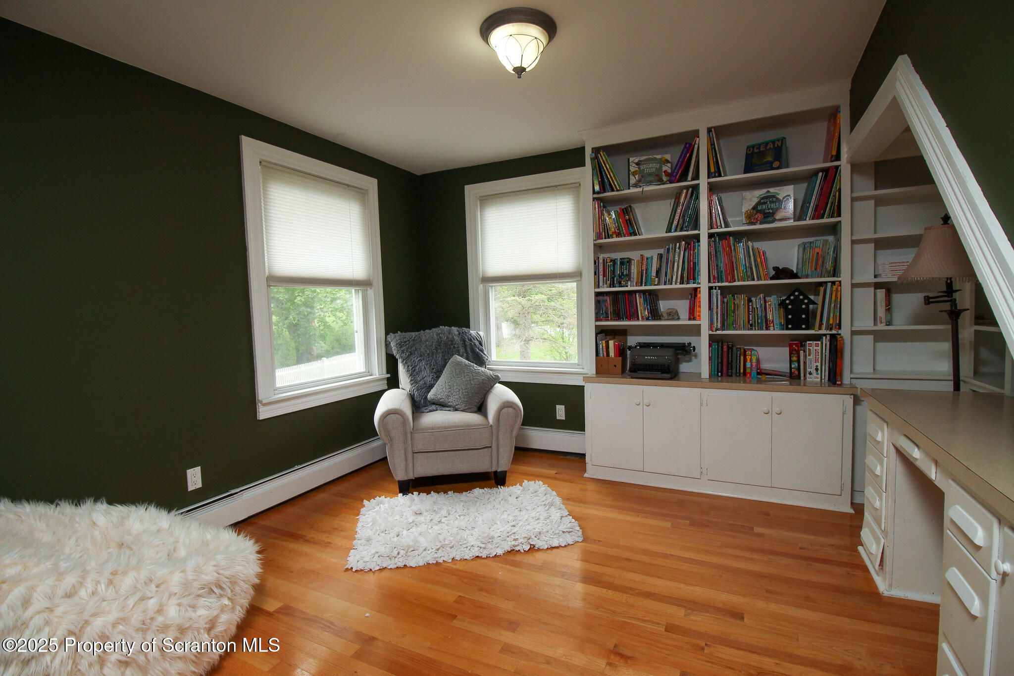 525 North Abington Road Clarks Summit, PA 18411 - Photo 29 of 61 a living room with furniture and a book shelf