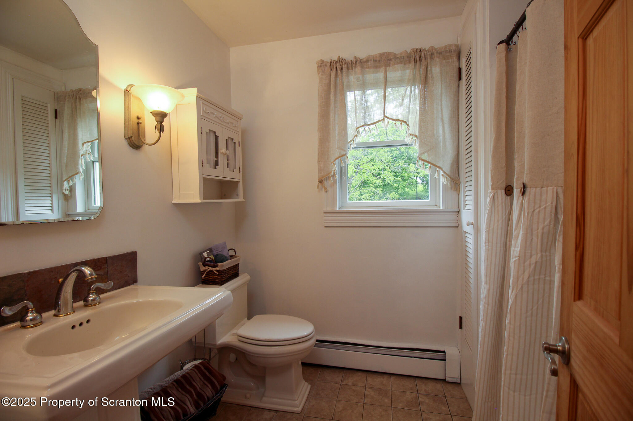 525 North Abington Road Clarks Summit, PA 18411 - Photo 35 of 61 a bathroom with a sink and a toilet