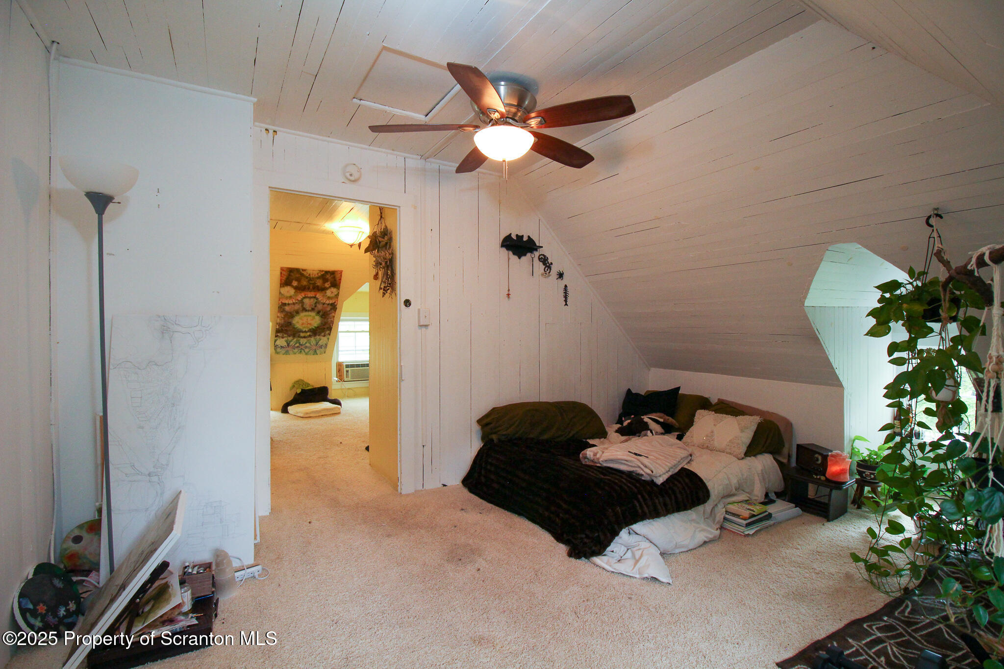 525 North Abington Road Clarks Summit, PA 18411 - Photo 37 of 61 a bedroom with a bed and a chandelier