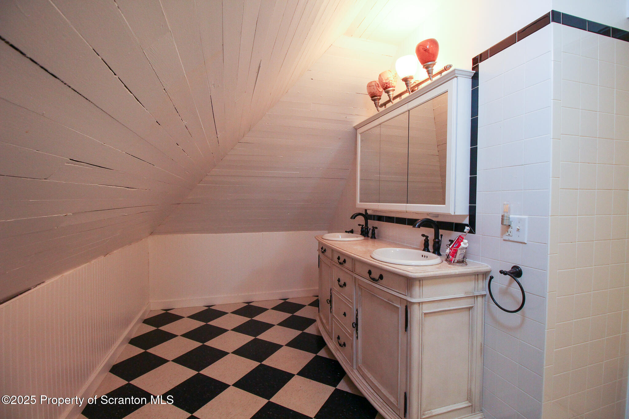 525 North Abington Road Clarks Summit, PA 18411 - Photo 39 of 61 a bathroom with a sink and a mirror