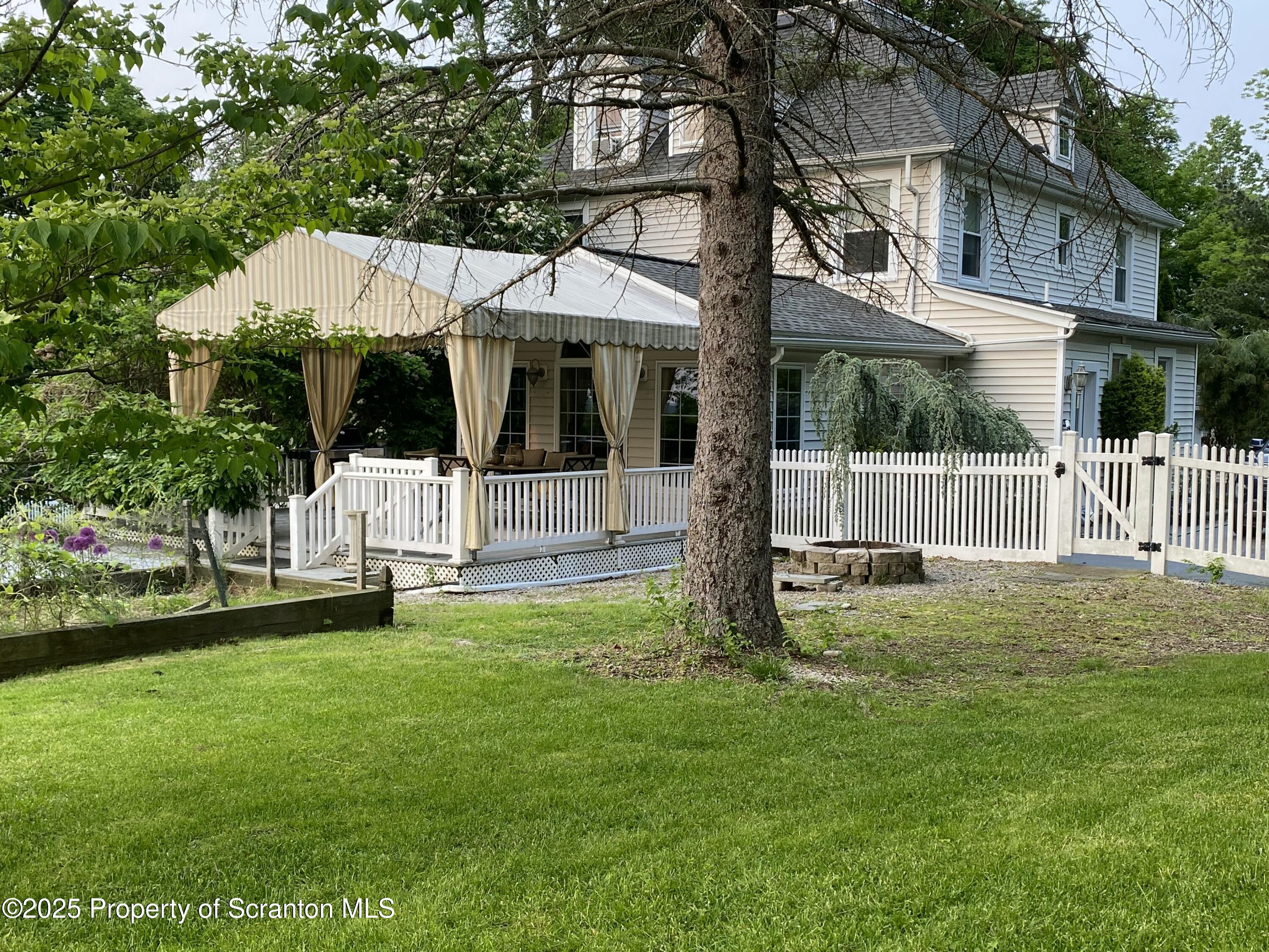 525 North Abington Road Clarks Summit, PA 18411 - Photo 5 of 61 a view of a house with a yard and sitting area