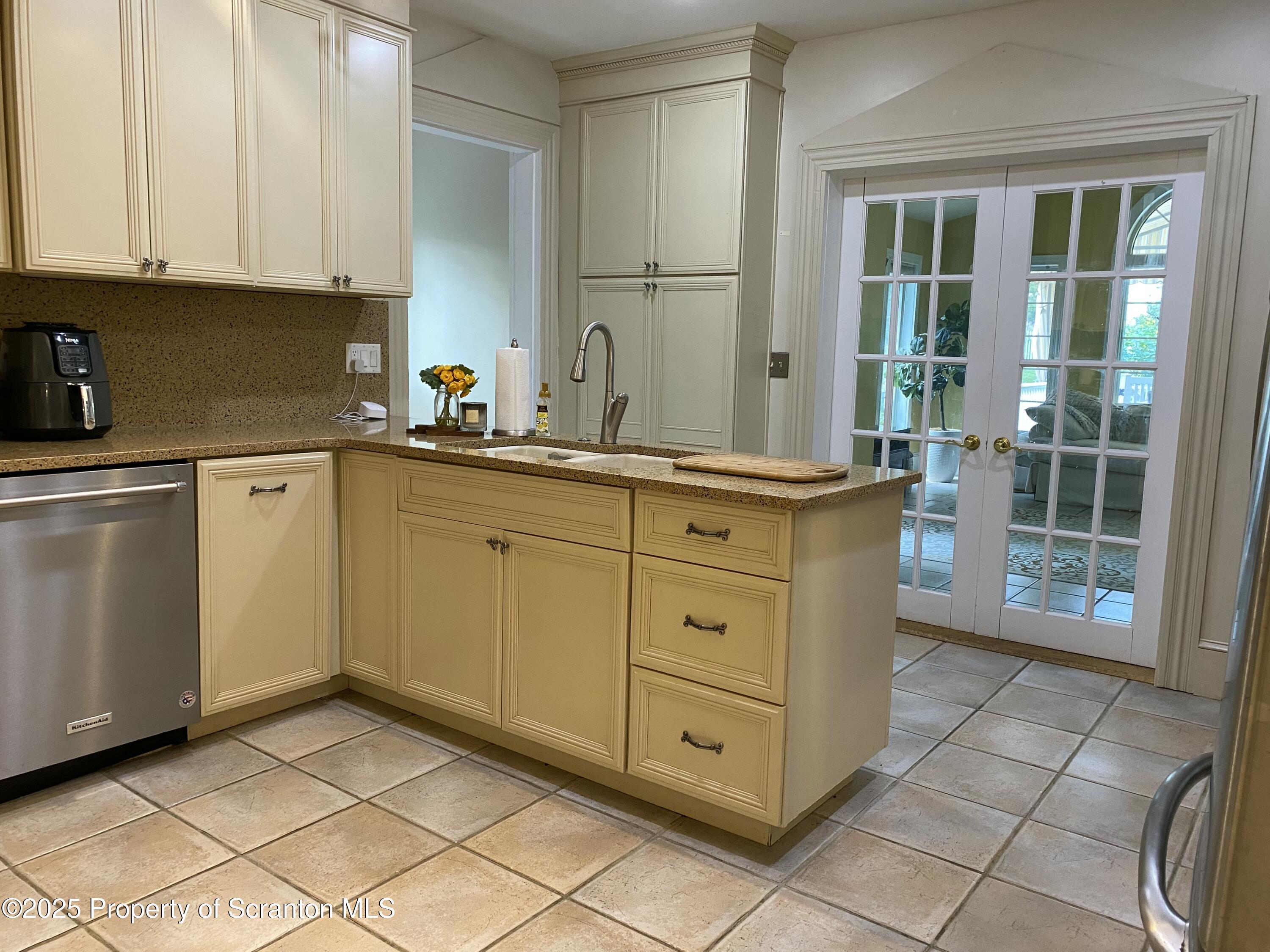 525 North Abington Road Clarks Summit, PA 18411 - Photo 10 of 61 a kitchen with white cabinets and sink