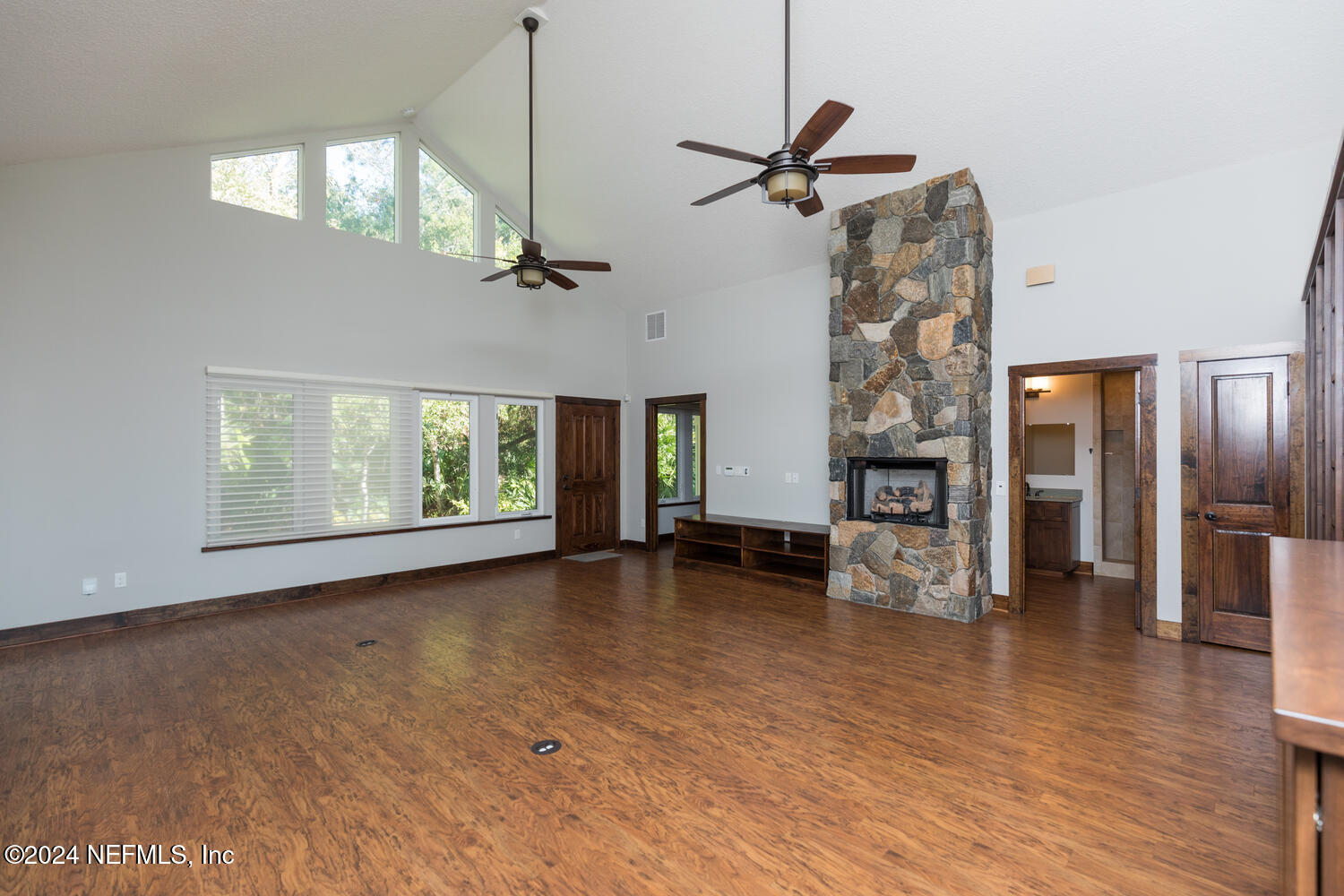 104 Loyola Road St. Augustine, FL 32086 - Photo 12 of 27 a view of empty room with wooden floor and fan