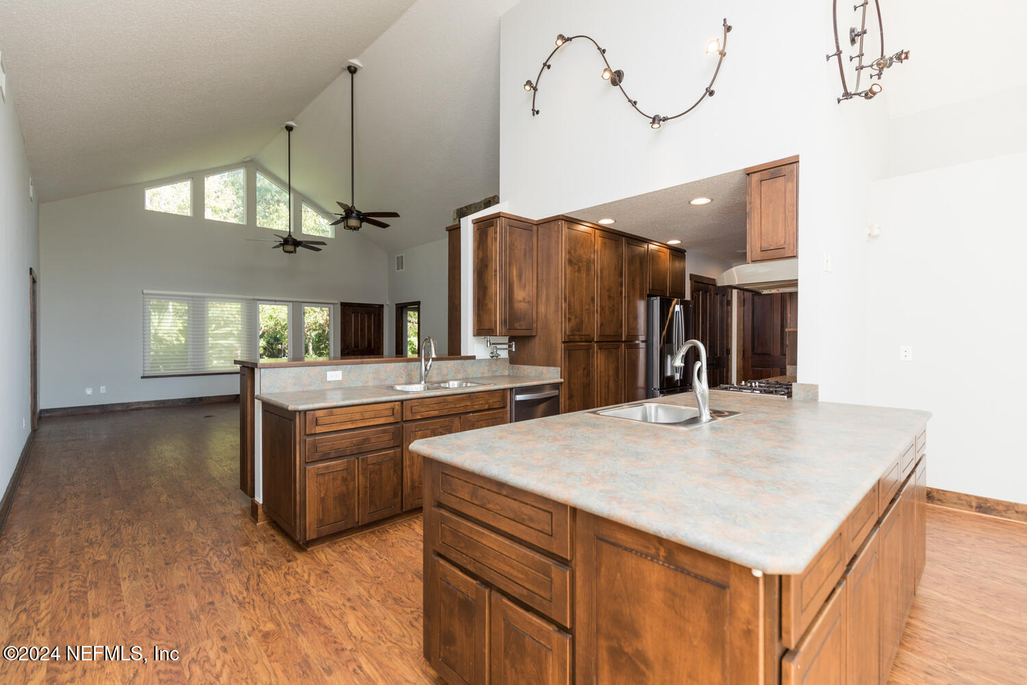 104 Loyola Road St. Augustine, FL 32086 - Photo 17 of 27 a kitchen with stainless steel appliances kitchen island a chandelier