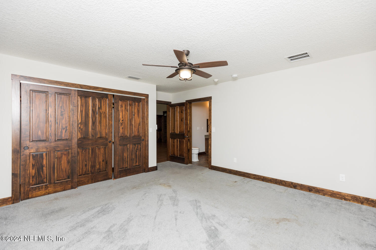 104 Loyola Road St. Augustine, FL 32086 - Photo 19 of 27 a view of a livingroom with a ceiling fan and a window