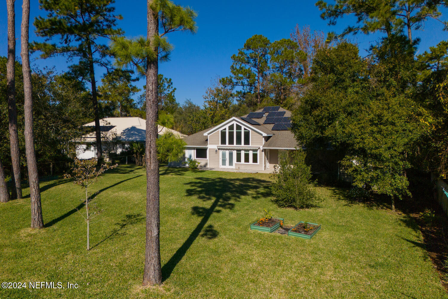 104 Loyola Road St. Augustine, FL 32086 - Photo 2 of 27 a house view with a yard