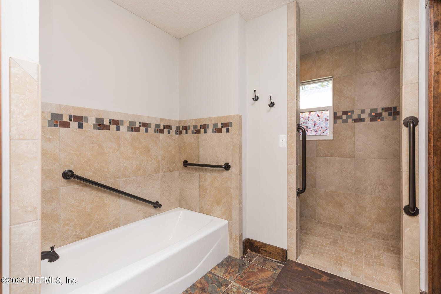 104 Loyola Road St. Augustine, FL 32086 - Photo 23 of 27 a bathroom with a bathtub and a shower