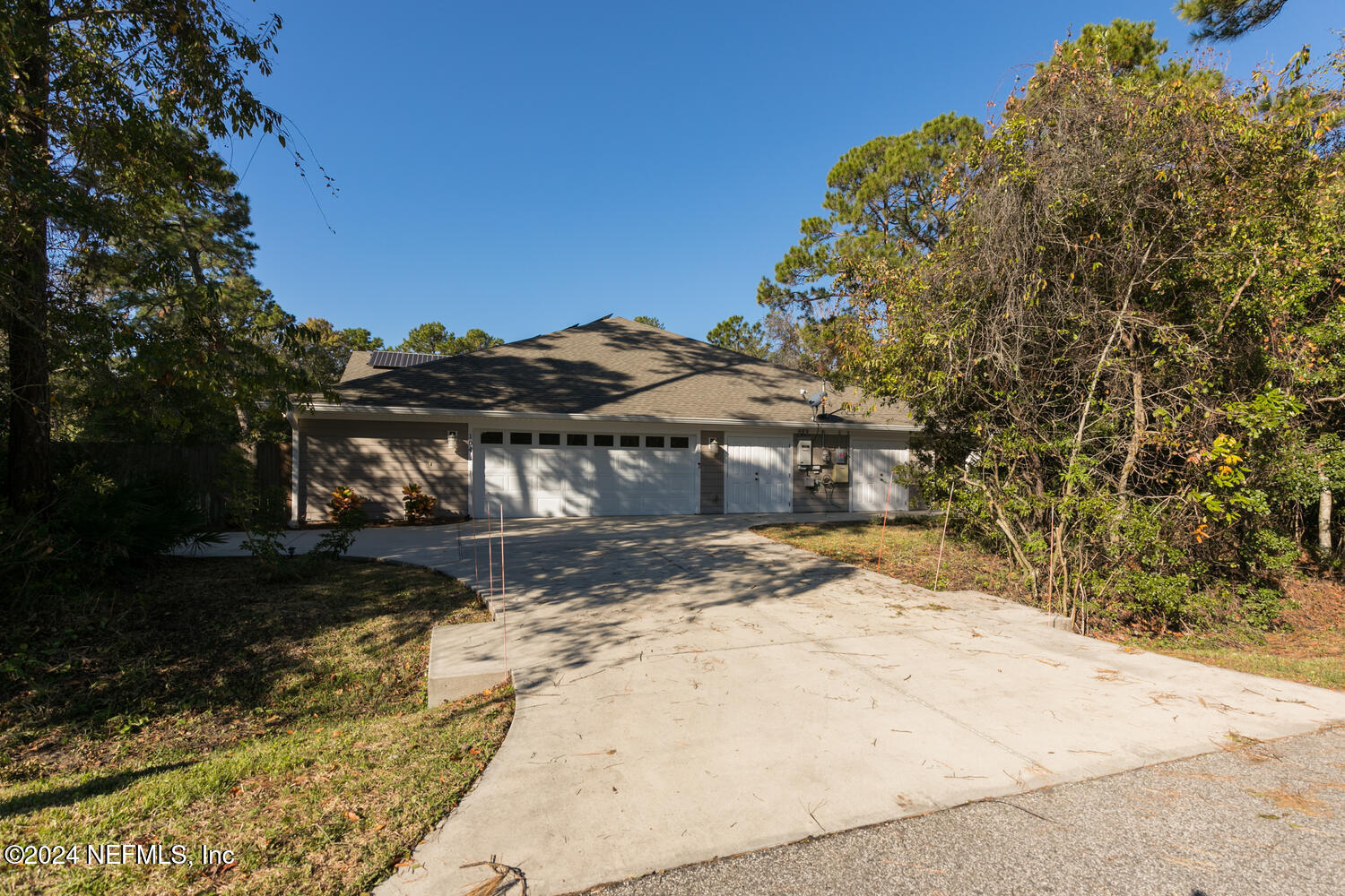 104 Loyola Road St. Augustine, FL 32086 - Photo 24 of 27 a view of a yard with plants and trees