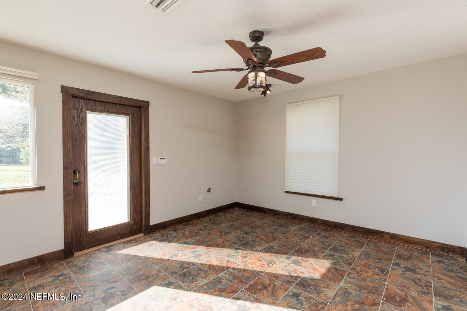 104 Loyola Road St. Augustine, FL 32086 - Photo 26 of 27 a view of a big room with wooden floor and windows in a room