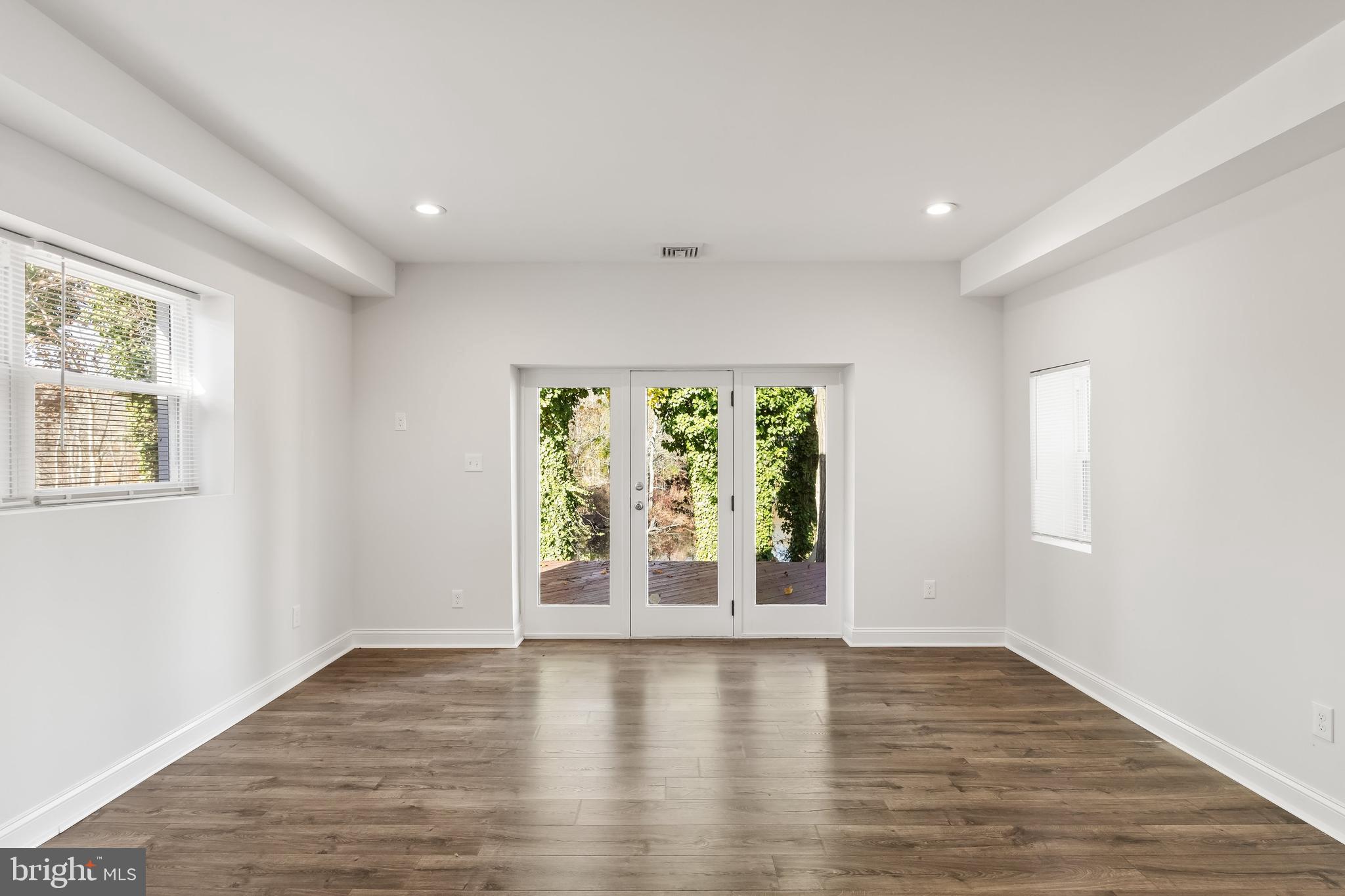 8 Lakeside Drive Medford, NJ 08055 - Photo 11 of 53 DINING AREA WITH SLIDERS TO DECK AND VIEW OF LAKE