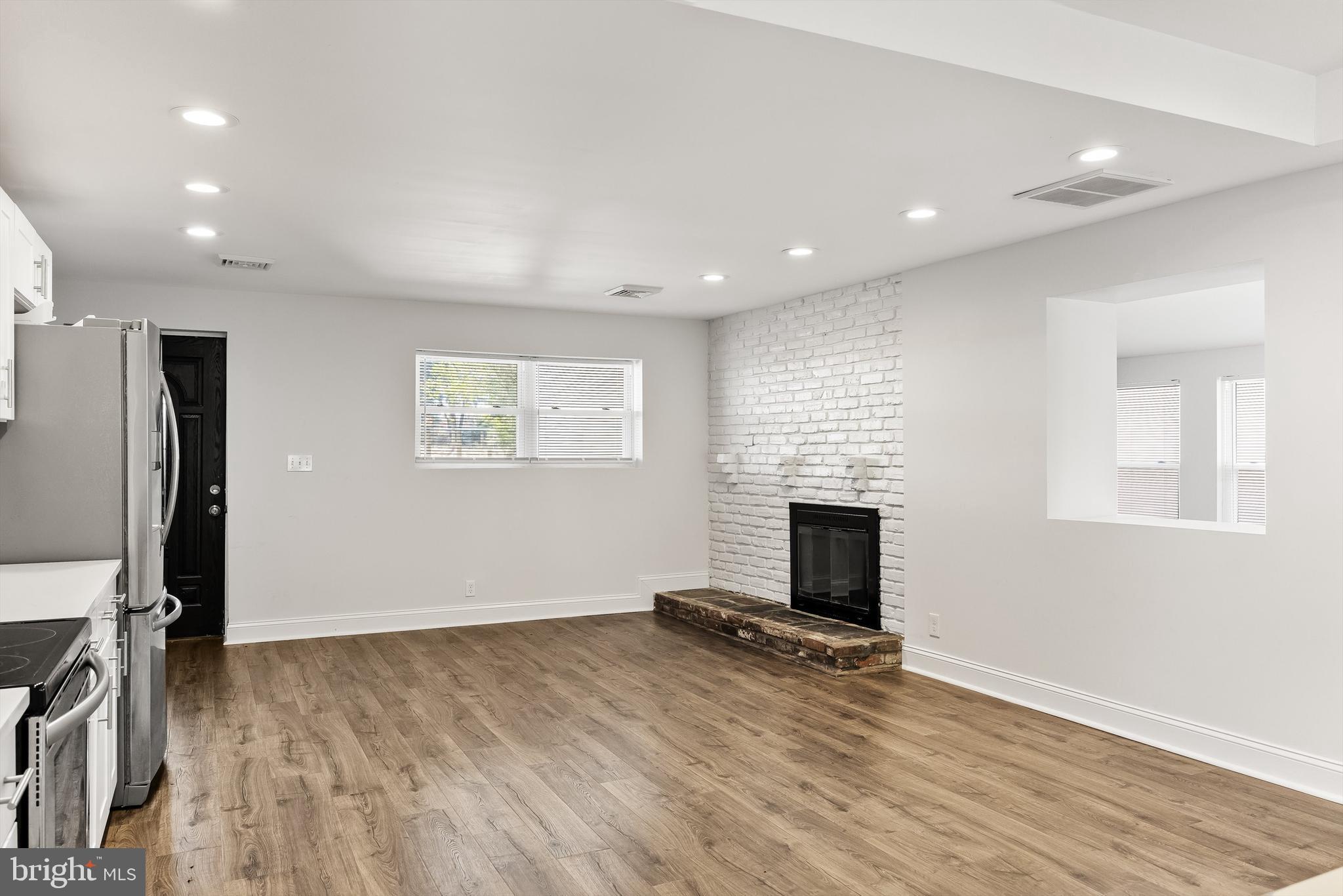 8 Lakeside Drive Medford, NJ 08055 - Photo 6 of 53 FRONT ENTRANCE TO KITCHEN WITH FIREPLACE