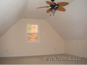 693 Rambling Creek Road Tryon, NC 28782 - Photo 6 of 12 a view of a window in an empty room