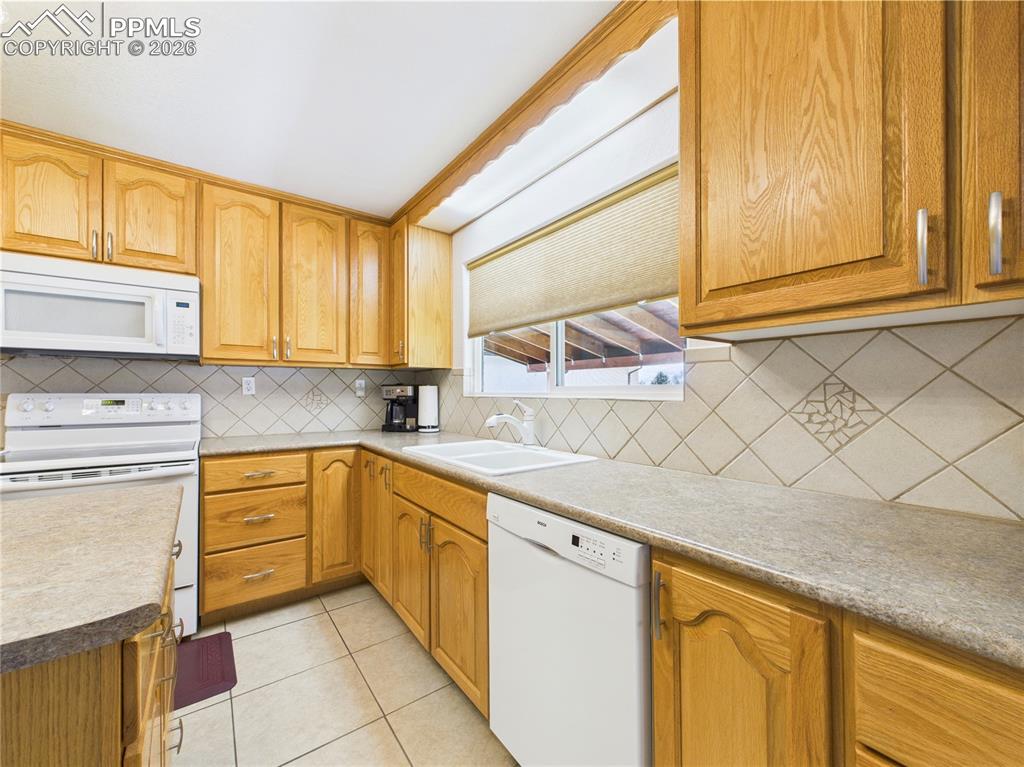 32006 Ford Road Pueblo, CO 81006 - Photo 22 of 50 a kitchen with stainless steel appliances granite countertop a sink and cabinets