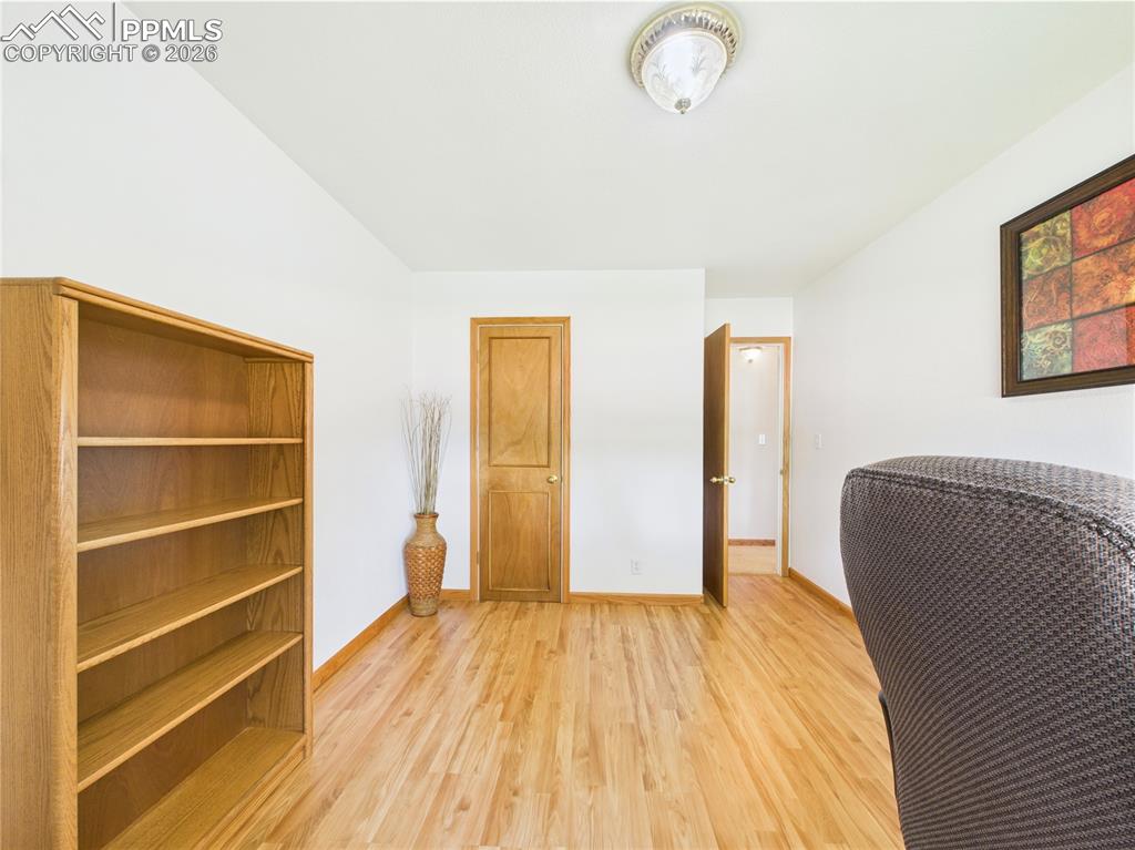 32006 Ford Road Pueblo, CO 81006 - Photo 26 of 50 a view of room with wooden floor and fan