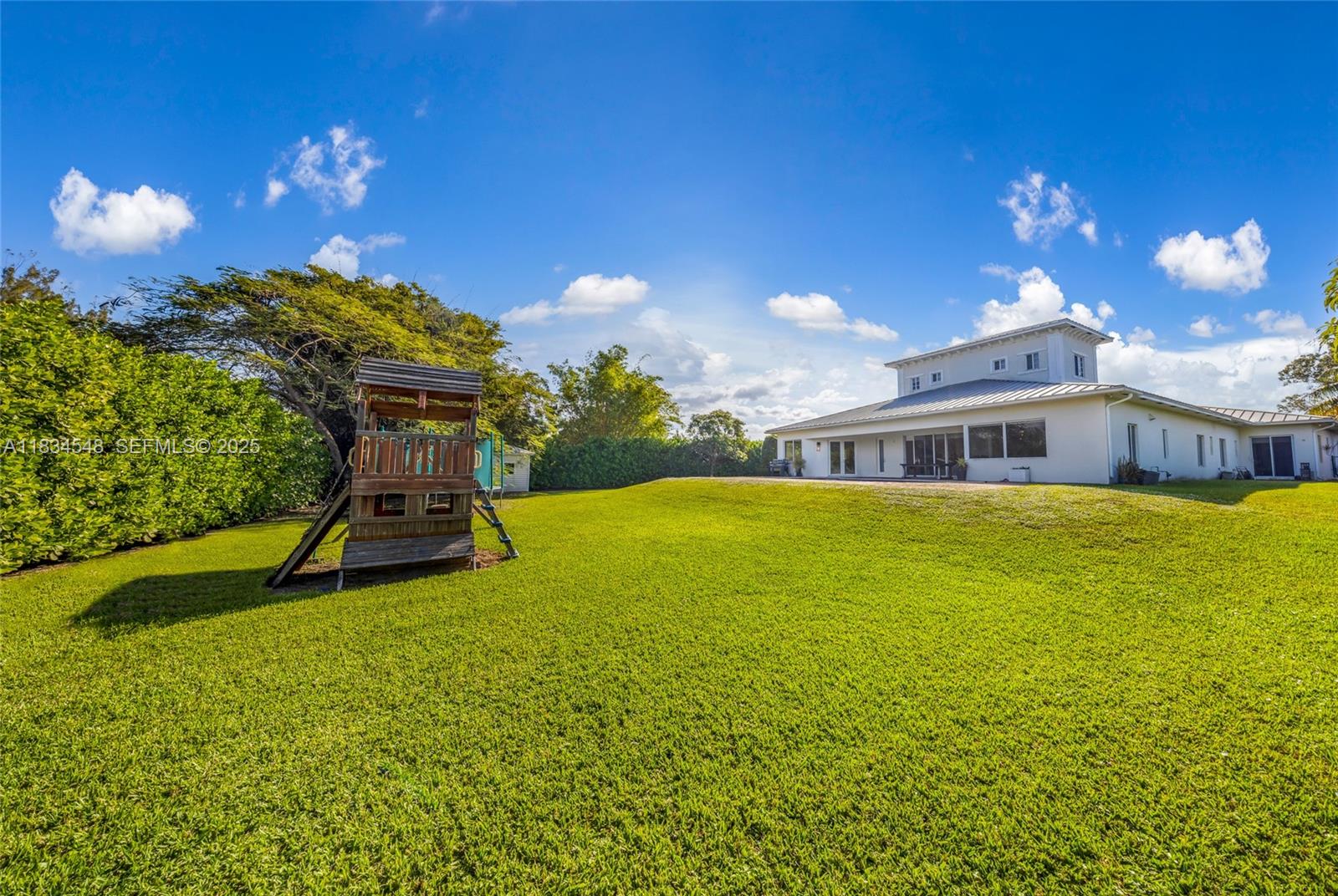 16701 Southwest 49th Street Southwest Ranches, FL 33331 - Photo 54 of 56 a house view with swimming pool