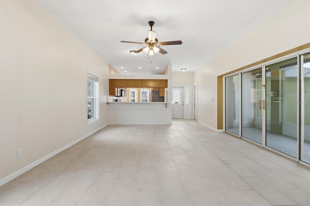 6301 West Glynborne Loop Crystal River, FL 34429 - Photo 15 of 63 an empty room with a ceiling fan and a rug