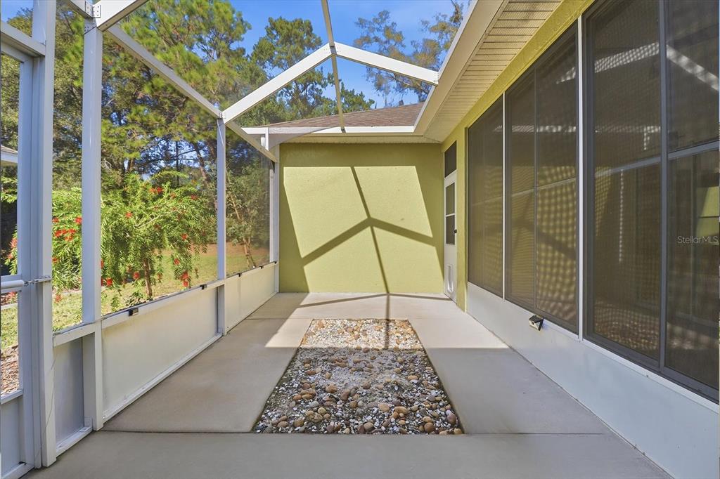 6301 West Glynborne Loop Crystal River, FL 34429 - Photo 19 of 63 a view of a hallway with a glass door