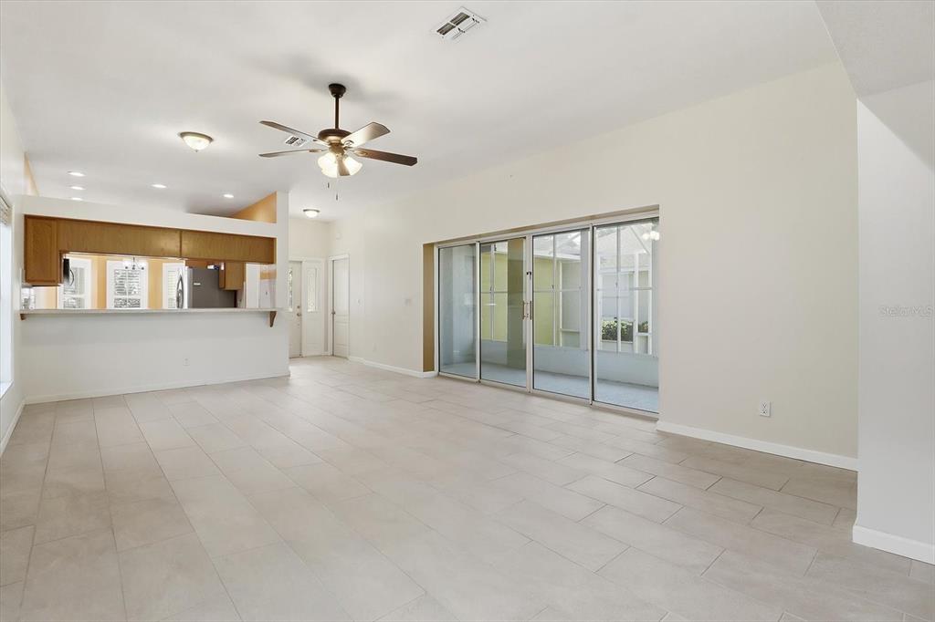 6301 West Glynborne Loop Crystal River, FL 34429 - Photo 23 of 63 a view of a livingroom with a ceiling fan and windows