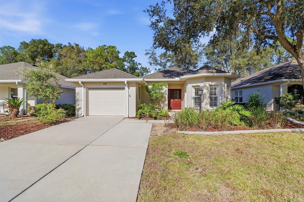 6301 West Glynborne Loop Crystal River, FL 34429 - Photo 46 of 63 front view of a house with a yard