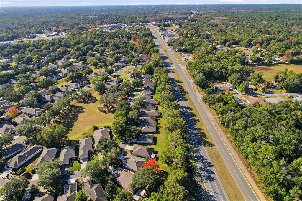 6301 West Glynborne Loop Crystal River, FL 34429 - Photo 50 of 63 an aerial view of residential houses with outdoor space and trees