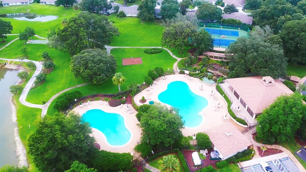 6301 West Glynborne Loop Crystal River, FL 34429 - Photo 54 of 63 an aerial view of a swimming pool a yard and outdoor seating