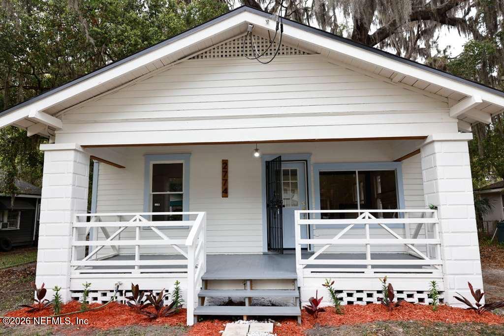 a front view of a house with a porch