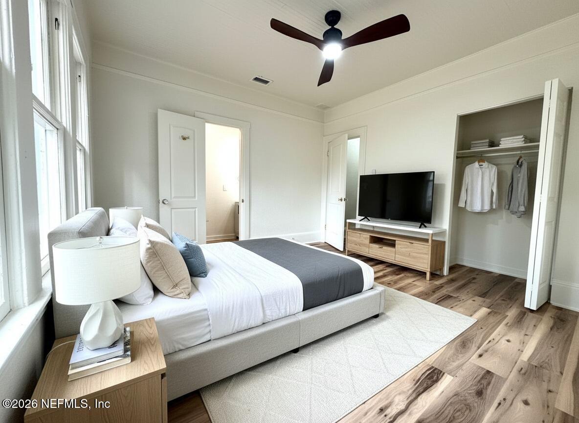 2774 Fitzgerald Street Jacksonville, FL 32254 - Photo 11 of 15 a bedroom with a bed and a flat screen tv