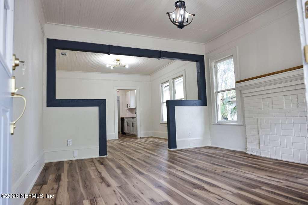 2774 Fitzgerald Street Jacksonville, FL 32254 - Photo 3 of 15 wooden floor in an empty room with a window