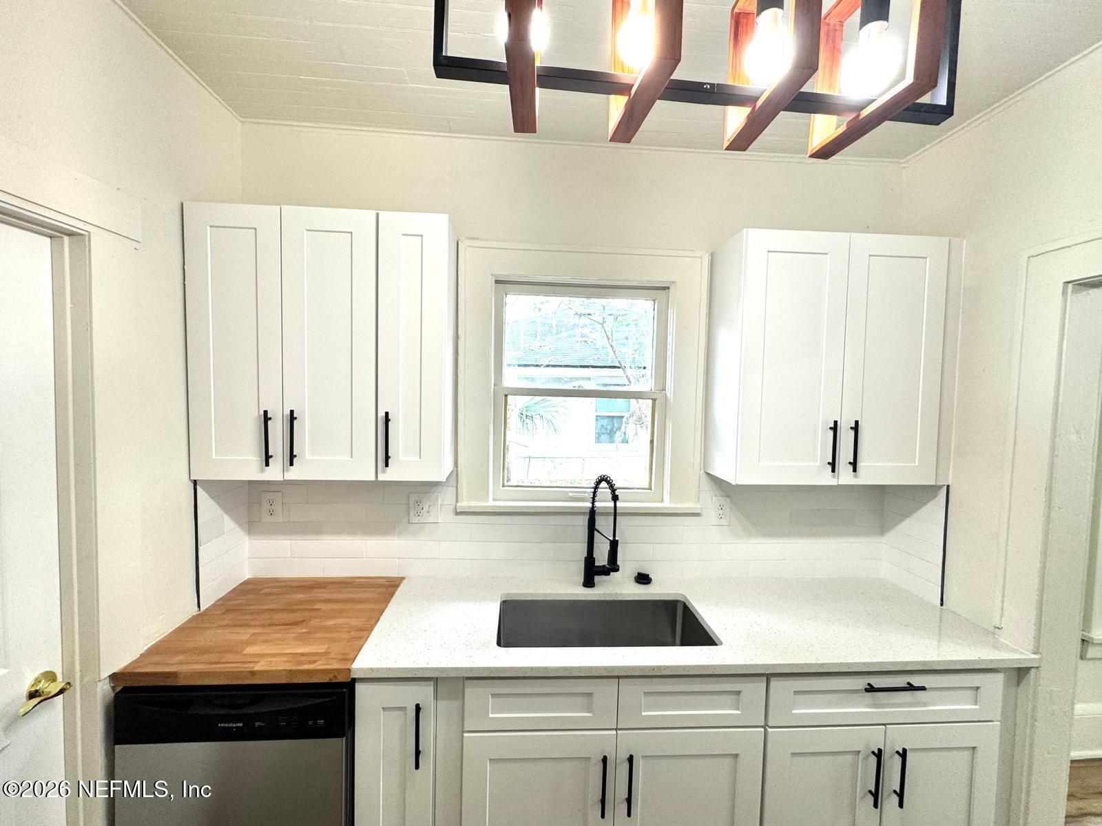 2774 Fitzgerald Street Jacksonville, FL 32254 - Photo 5 of 15 a kitchen with a sink and cabinets