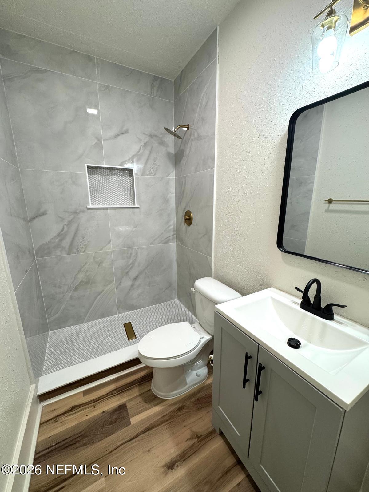 2774 Fitzgerald Street Jacksonville, FL 32254 - Photo 9 of 15 a bathroom with a sink toilet and shower