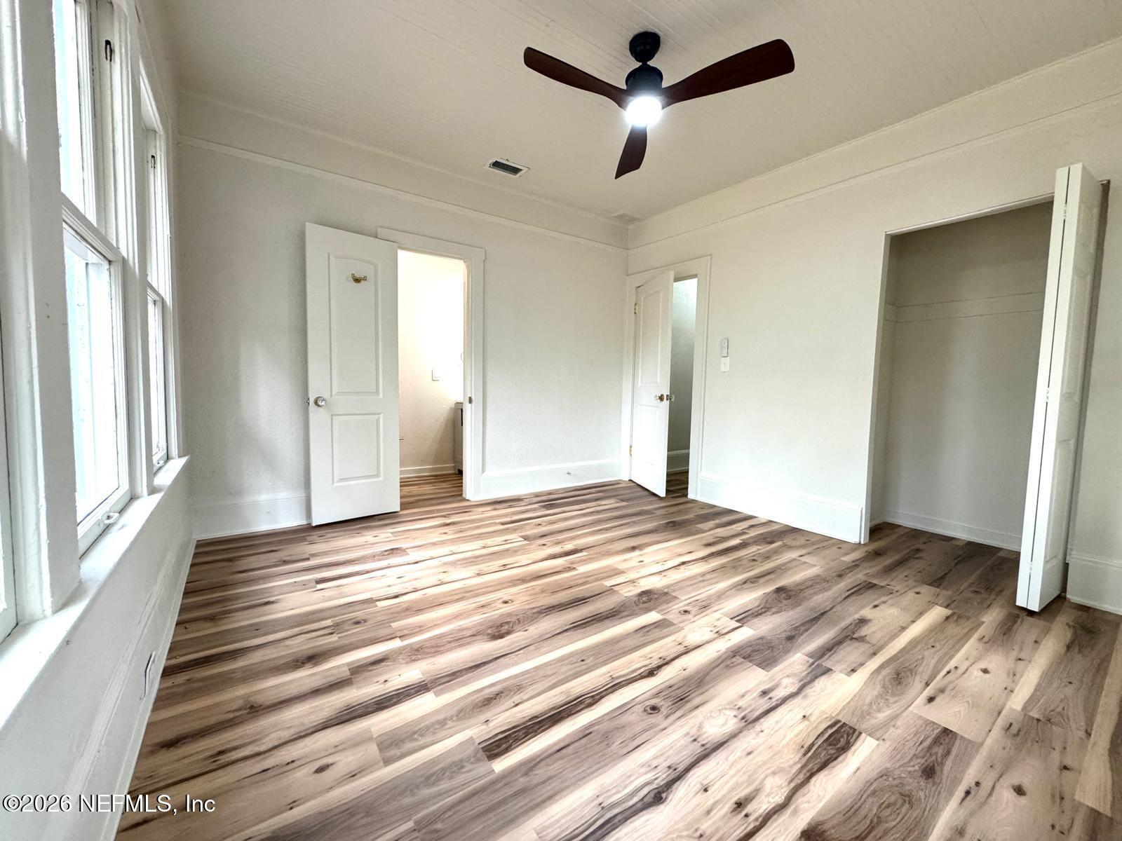 2774 Fitzgerald Street Jacksonville, FL 32254 - Photo 10 of 15 a view of a livingroom with wooden floor and a ceiling fan